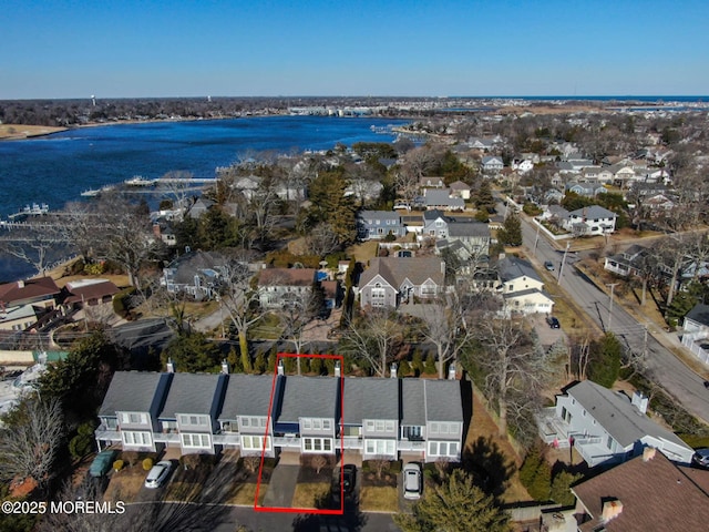 bird's eye view with a residential view and a water view