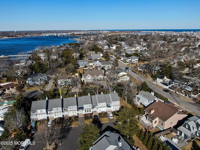 bird's eye view featuring a water view and a residential view