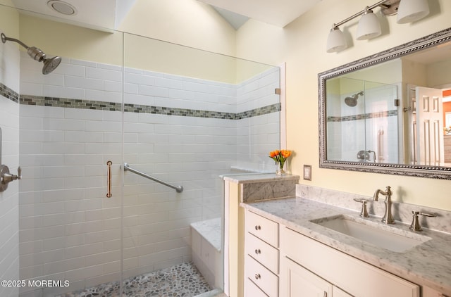 full bath featuring a stall shower and vanity