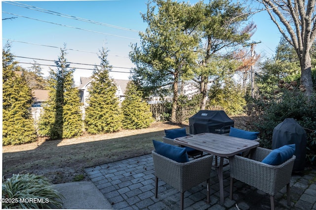 view of patio / terrace featuring outdoor dining area, fence, and area for grilling