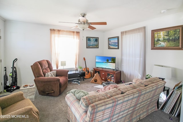 carpeted living room with ceiling fan