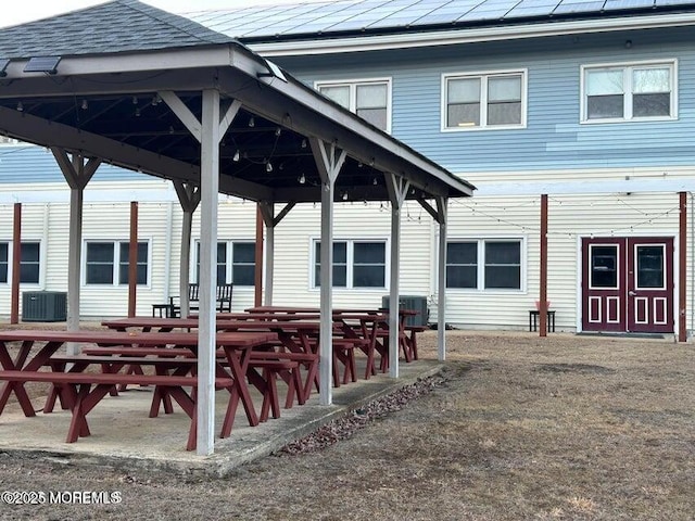 view of patio with a gazebo and central AC unit