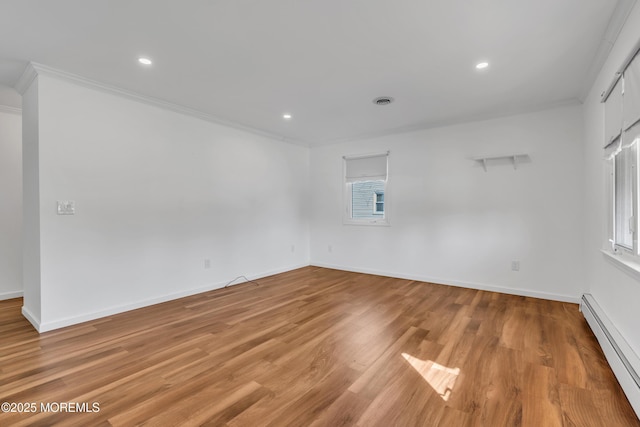 unfurnished room featuring light wood-type flooring, a baseboard radiator, baseboards, and ornamental molding