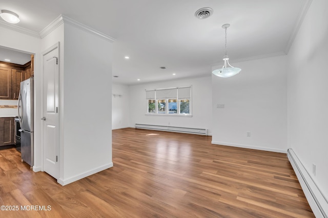 interior space featuring light wood-type flooring, visible vents, and a baseboard radiator