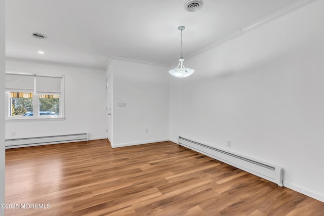 unfurnished dining area featuring light wood finished floors, visible vents, and baseboard heating