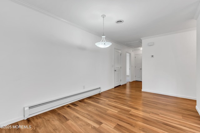 spare room with baseboards, visible vents, ornamental molding, a baseboard heating unit, and light wood-type flooring