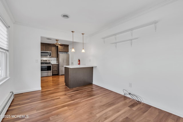 kitchen featuring dark brown cabinetry, ornamental molding, stainless steel appliances, and a baseboard radiator