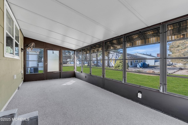 unfurnished sunroom with lofted ceiling