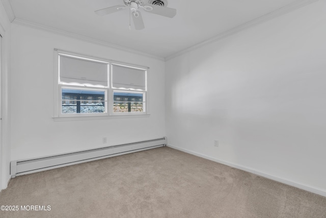 carpeted empty room featuring a baseboard heating unit, baseboards, ornamental molding, and a ceiling fan