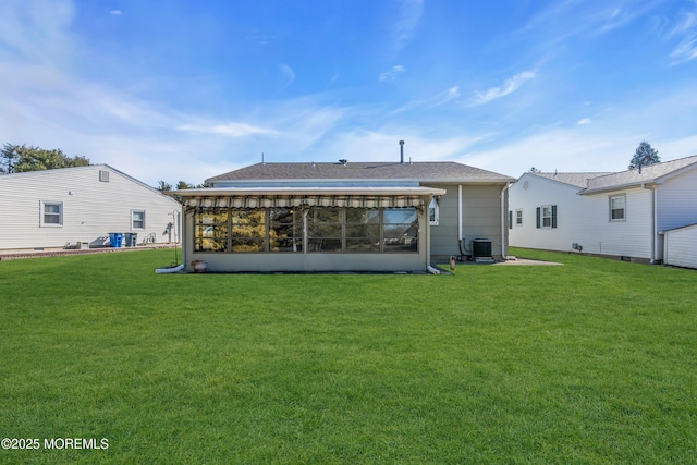 back of house with a lawn, central AC, and a sunroom