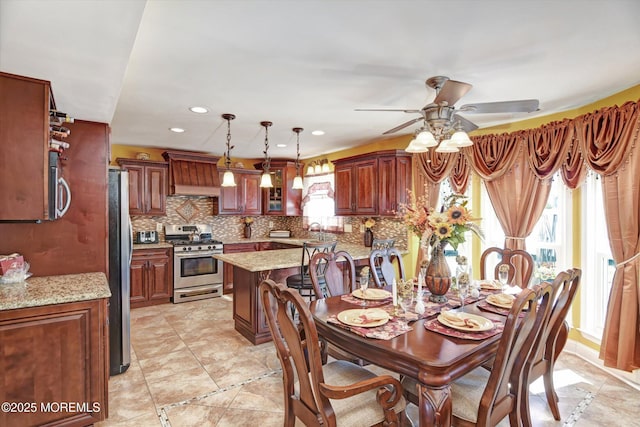 dining room featuring a ceiling fan and recessed lighting