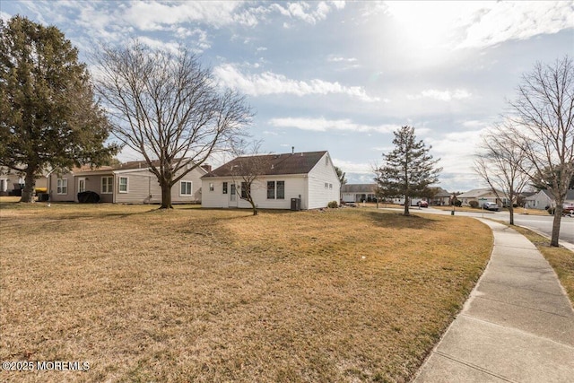 view of front of property with a front yard and a residential view