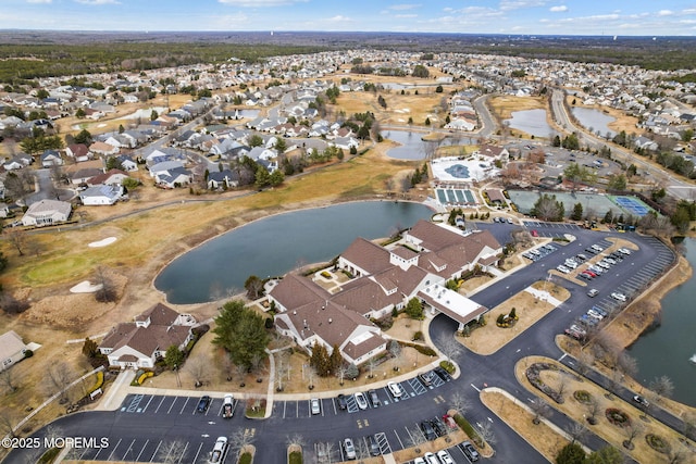 birds eye view of property featuring a residential view and a water view