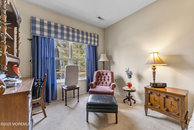 sitting room featuring carpet floors, baseboards, and visible vents