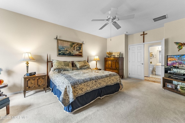 bedroom featuring ensuite bath, visible vents, ceiling fan, and light colored carpet