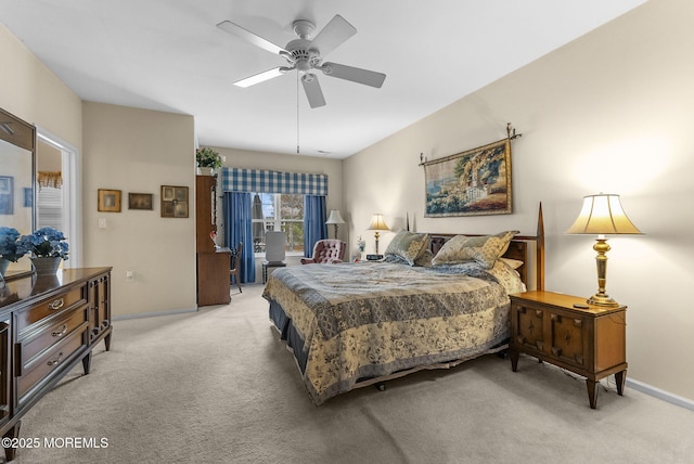 bedroom featuring light carpet, ceiling fan, and baseboards