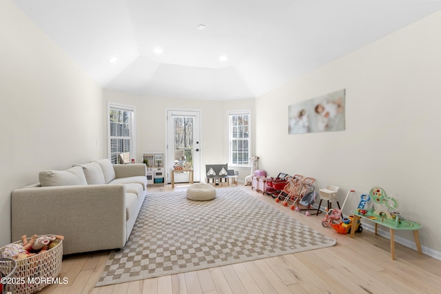 recreation room with recessed lighting, baseboards, and wood finished floors