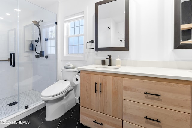 full bath with a stall shower, tile patterned flooring, vanity, and toilet