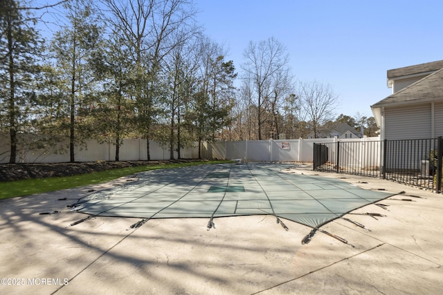 view of swimming pool with a patio area, a fenced backyard, and a fenced in pool