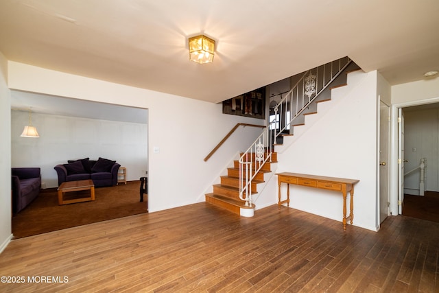 interior space featuring stairway and wood finished floors