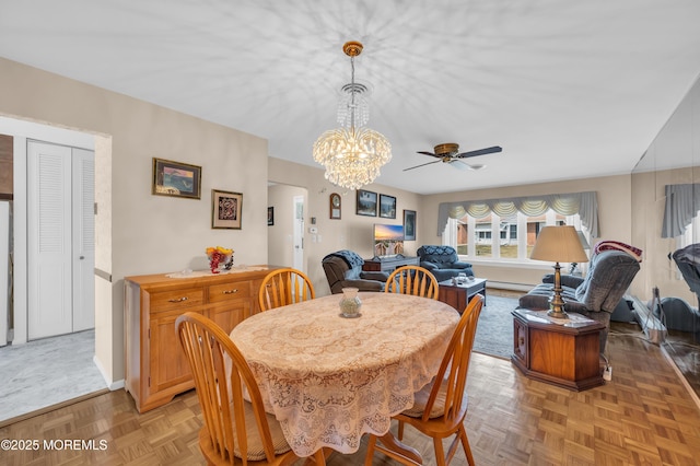 dining area featuring a ceiling fan and baseboards