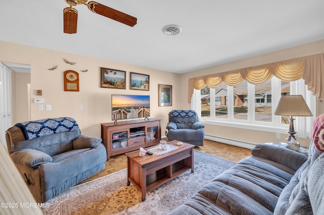 living room with a baseboard radiator, visible vents, and ceiling fan