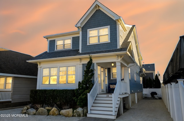 view of front of house with fence