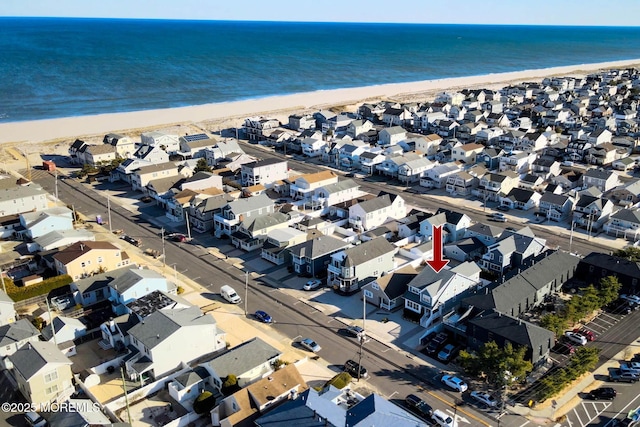 bird's eye view with a view of the beach, a residential view, and a water view