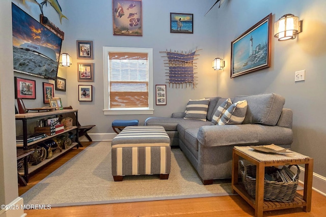 living room with wood finished floors and baseboards