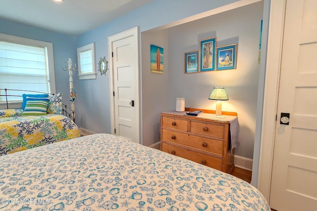 bedroom featuring baseboards