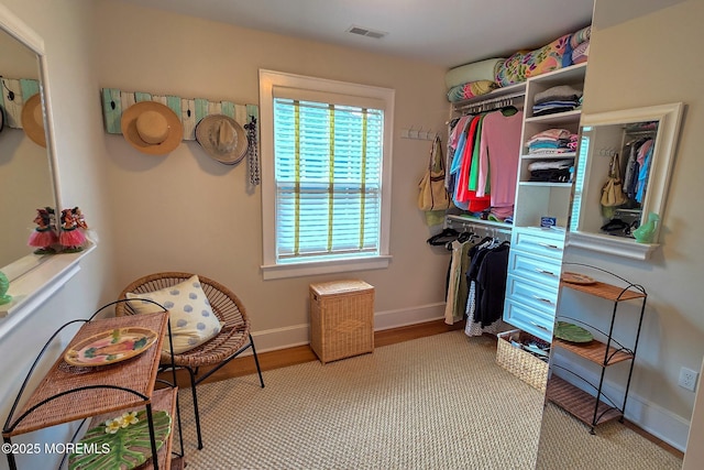 walk in closet with visible vents