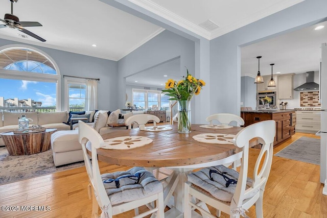 dining space featuring light wood finished floors, visible vents, ceiling fan, ornamental molding, and recessed lighting