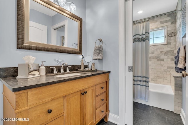 bathroom with tile patterned flooring, shower / bath combination with curtain, vanity, and baseboards