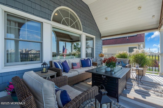 wooden terrace featuring an outdoor hangout area