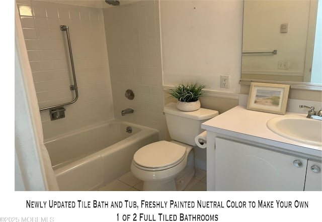 bathroom featuring tile patterned floors, vanity, toilet, and washtub / shower combination