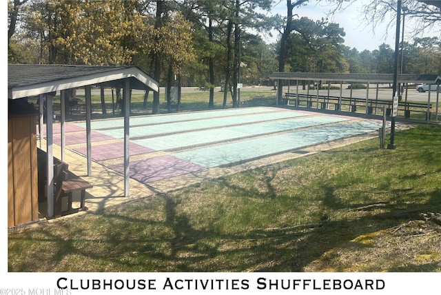exterior space featuring shuffleboard and a lawn