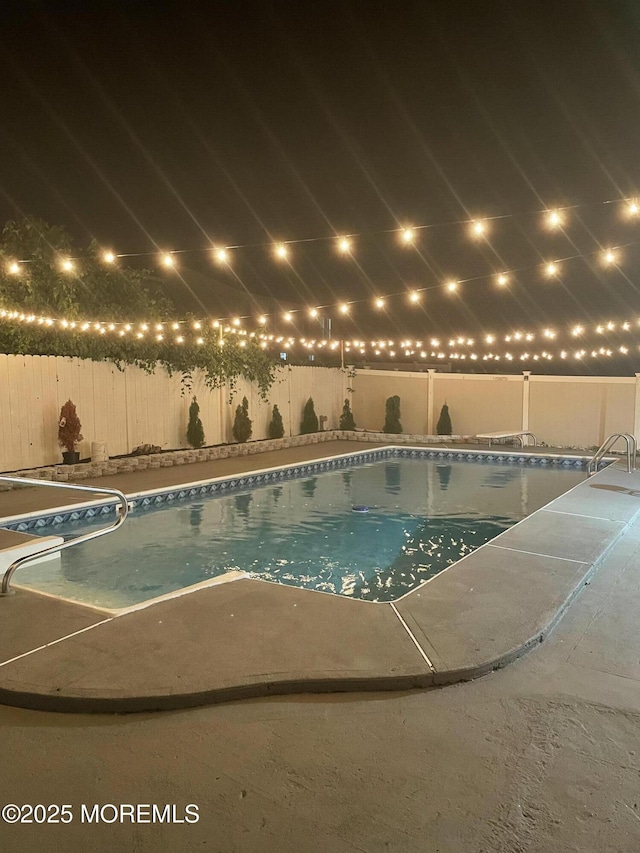 view of pool with a patio, a fenced backyard, and a fenced in pool