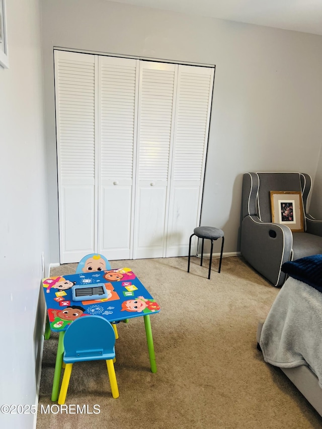 game room featuring baseboards and carpet
