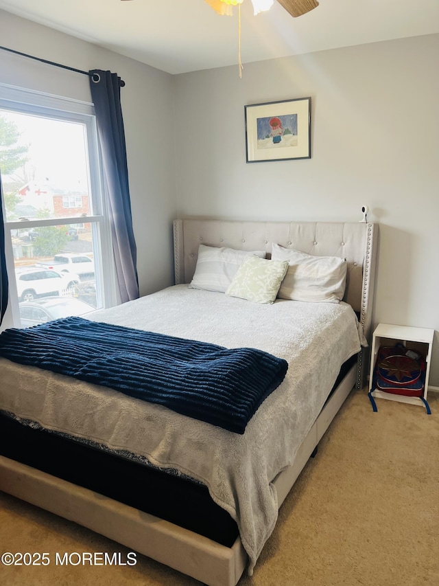 bedroom featuring light colored carpet