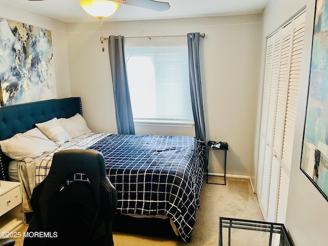 bedroom featuring baseboards, a closet, and carpet floors