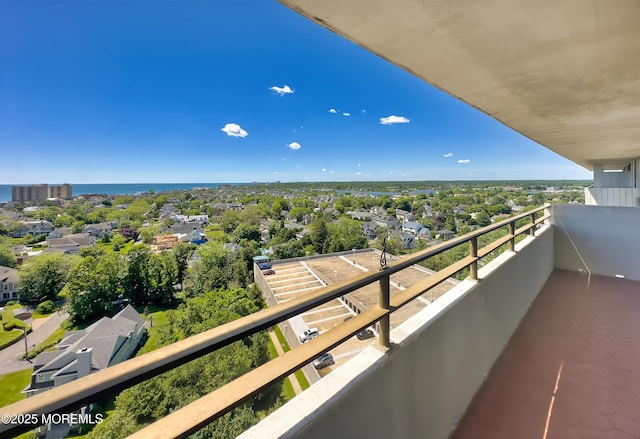 balcony featuring a water view