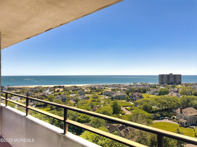 balcony featuring a water view