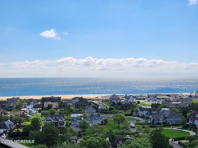 birds eye view of property featuring a residential view and a water view