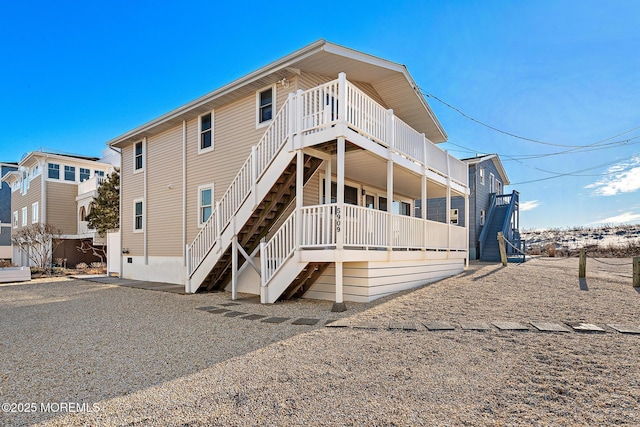 5909 Ocean Blvd, Long Beach Twp, NJ 08008 - back of house featuring stairway