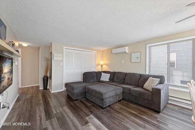 5909 Ocean Blvd, Long Beach Twp, NJ 08008 - living room with baseboards, a textured ceiling, wood finished floors, and a wall unit AC
