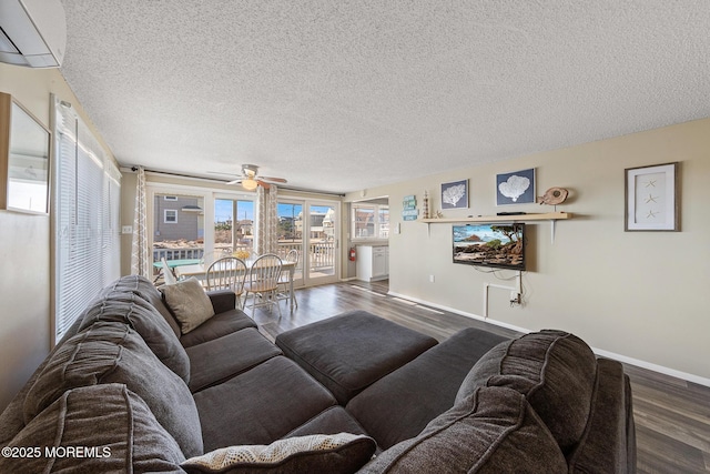5909 Ocean Blvd, Long Beach Twp, NJ 08008 - living room featuring a wall mounted air conditioner, a textured ceiling, wood finished floors, baseboards, and ceiling fan