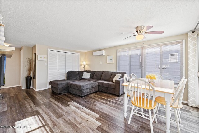 5909 Ocean Blvd, Long Beach Twp, NJ 08008 - living area featuring a textured ceiling, wood finished floors, baseboards, and a wall mounted AC
