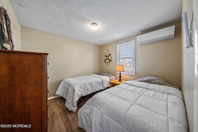 5909 Ocean Blvd, Long Beach Twp, NJ 08008 - bedroom featuring a wall unit AC, wood finished floors, and a textured ceiling