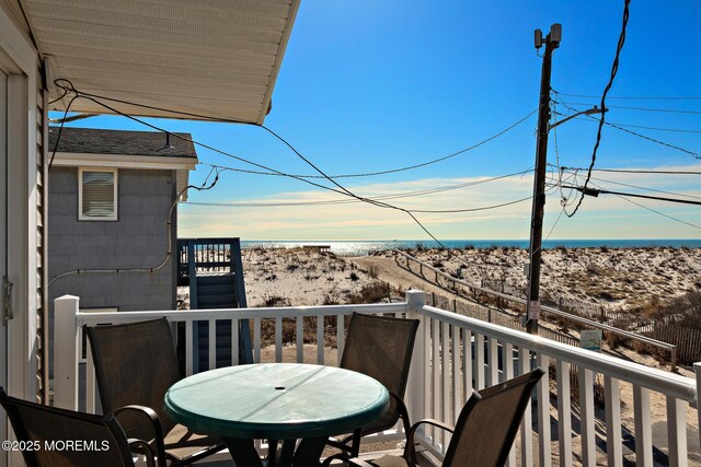 5909 Ocean Blvd, Long Beach Twp, NJ 08008 - balcony with a view of the beach, outdoor dining area, and a water view