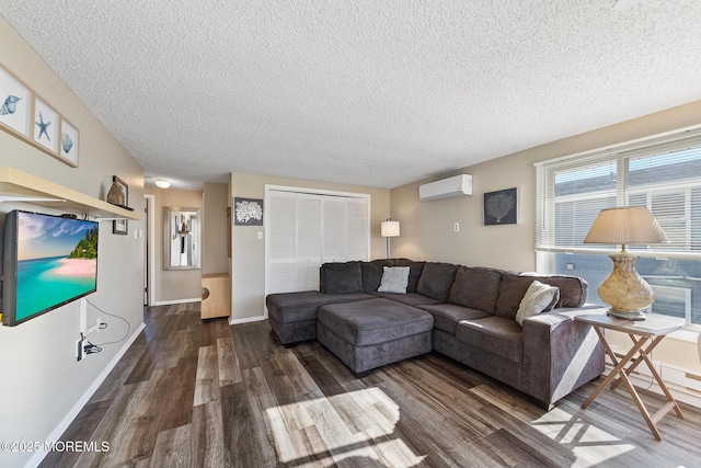 5909 Ocean Blvd, Long Beach Twp, NJ 08008 - living area with baseboards, a textured ceiling, dark wood finished floors, and a wall mounted AC